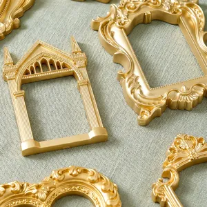 Detailed macro view of ornate golden 3-inch vintage style magnetic photo frames for fridge