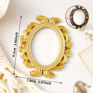 Detailed macro view of the gold ornate magnetic photo frame showing its 9.3x7.8cm dimensions
