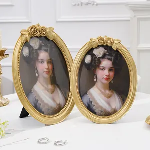 Elegant vintage golden oval resin photo frames with rose carvings and classic portraits
