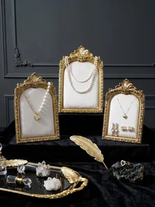 Vintage resin photo frame jewelry display stand, elegant baroque necklace and earring organizer rack.