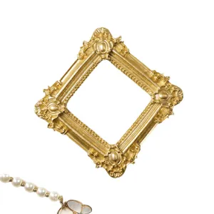 Ornate gold 3-inch magnetic photo frame for Polaroid pictures and fridge decor.
