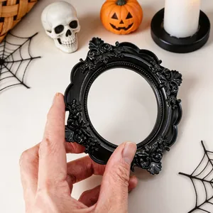 Detail view of a vintage black baroque embossed mini photo frame for Halloween props