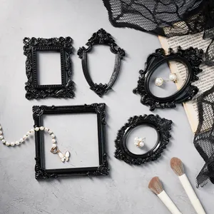 Vintage black baroque mini picture frames for jewelry display and Halloween photography props