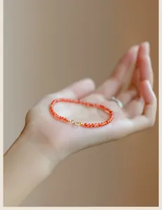 Detailed view of a 3mm natural South Red Agate beaded bracelet with fine ice texture