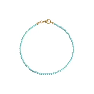 Handmade dainty 2mm natural turquoise beaded bracelet featuring a 14k gold lobster clasp closure