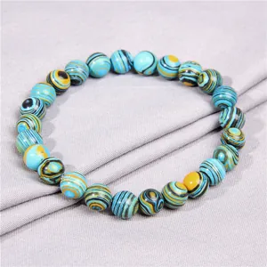 Handcrafted 8mm blue and yellow patterned stone bead elastic bracelet with stylish design