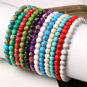Close-up view of multiple 6mm colorful natural stone bead bracelets on a display