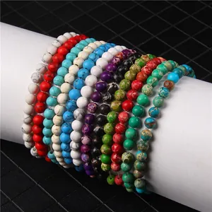 Close-up view of multiple colorful 6mm natural stone beaded elastic bracelets