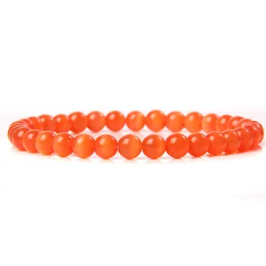Vibrant orange cat's eye stone bead bracelet with smooth 6mm elastic beads