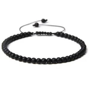 Minimalist handmade 4mm matte black stone bead bracelet with adjustable woven cord