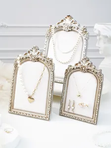 Vintage resin photo frame jewelry display stand set, elegant necklace organizer props.