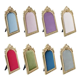 Set of 8 vintage gold-bordered velvet jewelry display stands in various colors for photography.