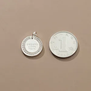 S925 sterling silver "Dreams Come True" round pendant with micro-pave zirconia.