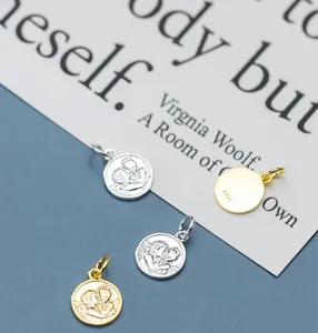 Detail shot of four S925 silver and gold plated angel portrait pendant jewelry charms.