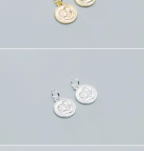 Detailed close-up view of S925 silver gold plated angel coin pendant DIY accessory