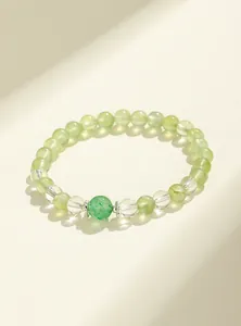 Close-up detail showing the natural texture of green prehnite and strawberry quartz beads