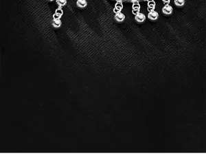 Macro detail view of S925 sterling silver 6mm dangling ball pendant charms for DIY jewelry