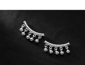 Close-up of S925 sterling silver curved tube with dangling beads for DIY jewelry