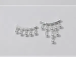 Detail view of S925 sterling silver curved tube pendant with 6mm hanging beads for DIY