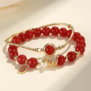 Elegant red agate bead bracelet set with freshwater pearl and golden snake charm