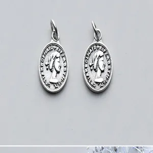 Close-up of vintage S925 silver Queen coin pendants for DIY jewelry making and craft projects