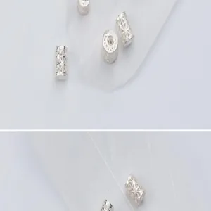 Gros plan de perles cylindriques évidées en argent S925 pour la création de bijoux