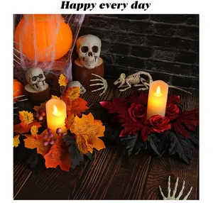 Halloween candle wreaths featuring maple leaves and roses in a spooky party themed setting