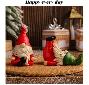 Detailed view of two Christmas gnomes in unique yoga poses for festive home decor
