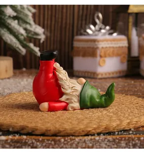 Close-up of a whimsical Christmas gnome figurine in a playful yoga pose on a rustic mat.