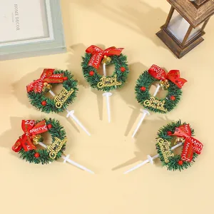 Set of five mini Christmas wreath cake toppers with red bows for festive holiday baking