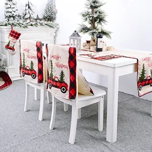 Christmas dining set featuring buffalo plaid chair covers and table runner with truck print