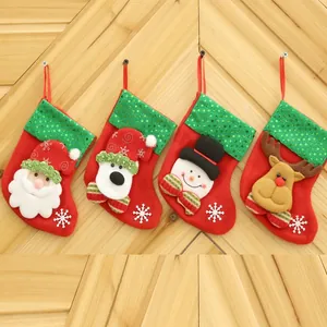 Set of 4 cartoon Christmas stockings with green sequins and cute character details.