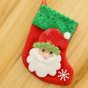 Detailed red Christmas stocking with Santa Claus face and shiny green sequins decoration