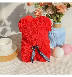 Close-up of a handmade red rose bear with Just for you ribbon decoration