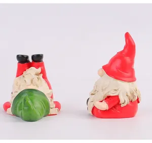 Detailed macro view of two creative Christmas gnomes performing yoga poses on white background