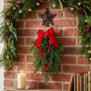 Festive Christmas swag with red bow and berries hanging on a rustic brick wall decor