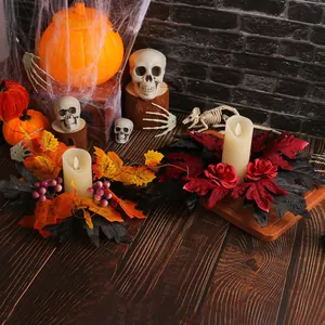 Halloween candle wreath with maple leaves and roses for festive tabletop decor