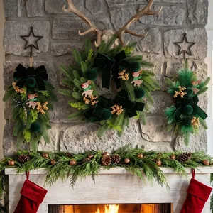 Dark green Christmas wreath and swag set with gold berries and reindeer decorations