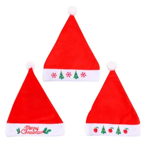 Set of three thick red velvet Christmas hats with embroidered festive holiday patterns