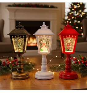 Trois lanternes décoratives de Noël illuminées avec Père Noël, bonhomme de neige et sapin de Noël
