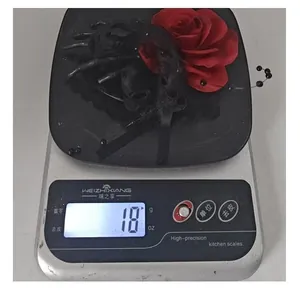Close-up detail showing the lightweight 18g Halloween skeleton hand rose hair clip