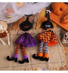 Detailed view of Halloween witch wine bottle covers with striped long legs and hats
