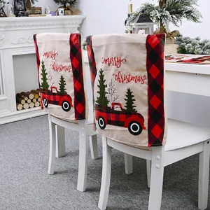 Red buffalo plaid Christmas chair covers with vintage truck design for dining room