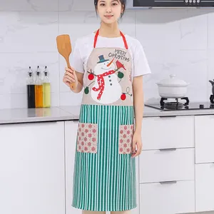 Festive Christmas linen apron featuring a cheerful snowman design with green striped pockets