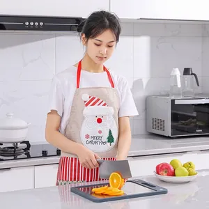 Festive Santa Claus linen apron for kitchen use with Merry Christmas design.