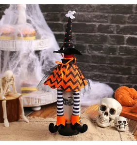 Macro view of witch wine bottle cover showing orange chevron pattern and tulle detail