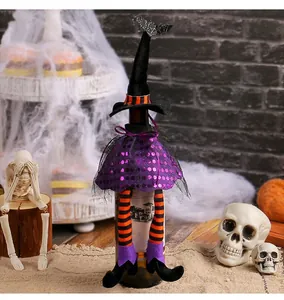 Halloween witch wine bottle cover with sequined skirt and striped long legs