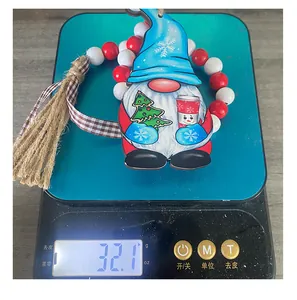Detailed view of Christmas gnome wooden ornament with beads and tassel weighing 32.1g