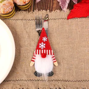 Christmas gnome cutlery holder with red felt hat and white beard for table decoration