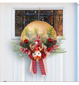 Close-up detail of bamboo basket Christmas wreath with reindeer plush and plaid bow
